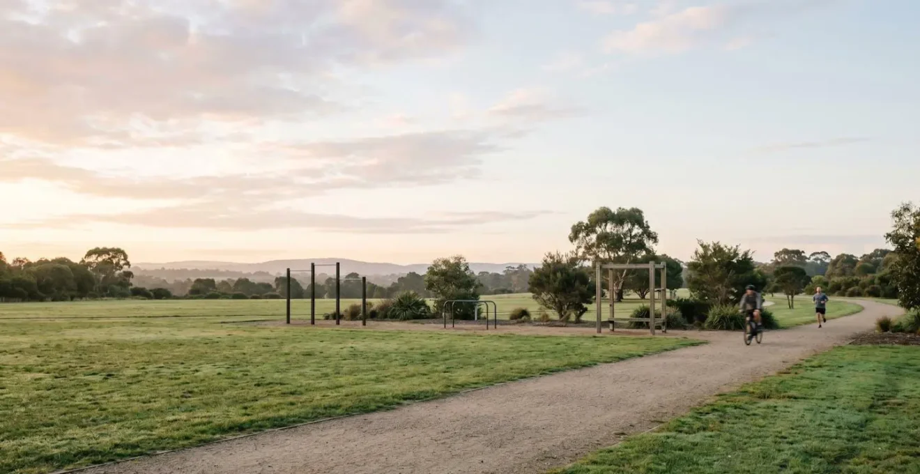 Wide environmental shot showing an outdoor workout space at dawn with multiple potential activity zones visible, suggesting flexible options within a structured framework