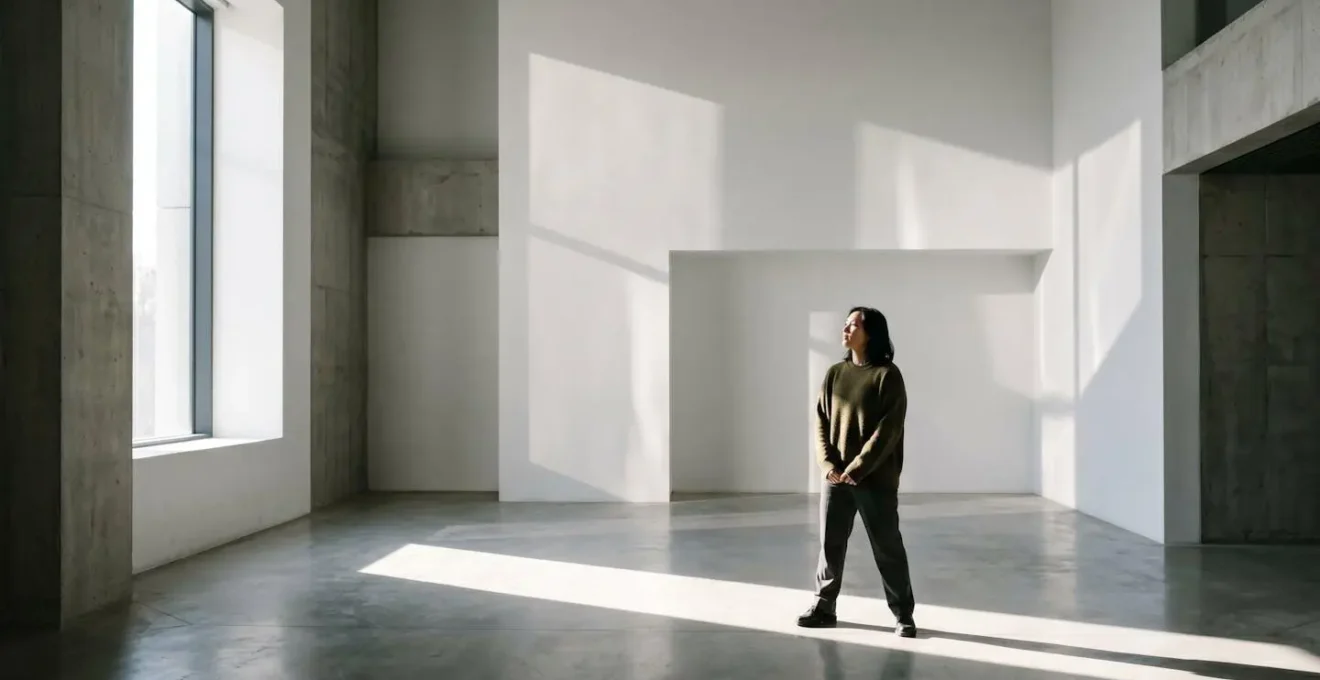 Split lighting portrait showing contrast between light and shadow symbolizing emotional duality