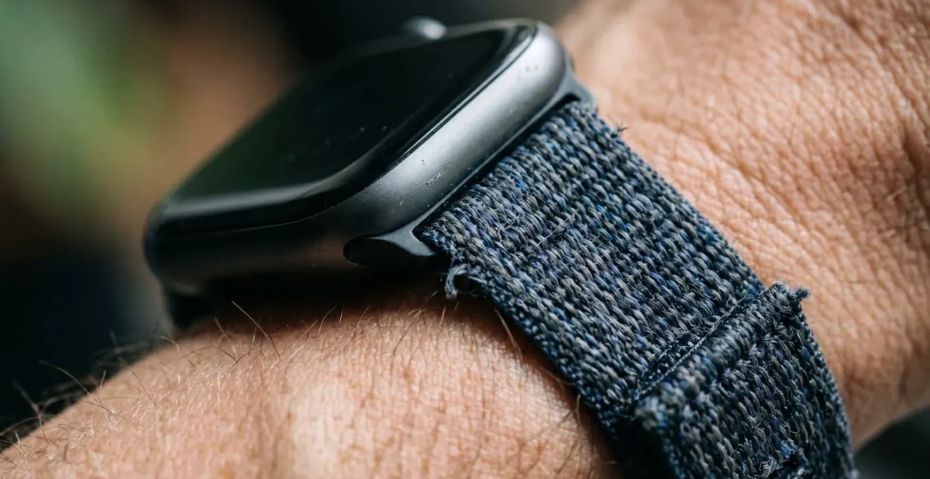 Extreme close-up of fitness tracking device showing texture and detail without readable display