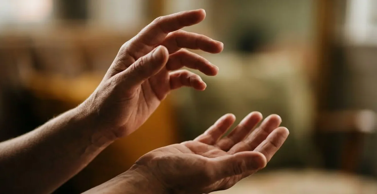 Hands gently holding a delicate object symbolizing personal narrative transformation and cognitive reframing